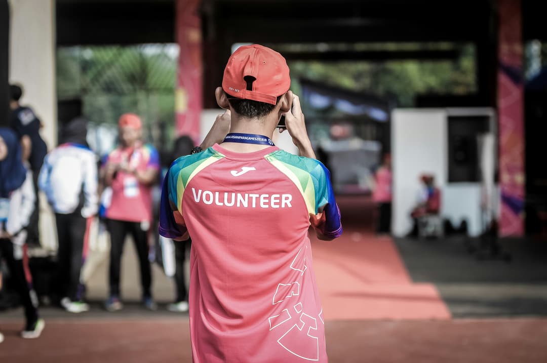 Image of young boy volunteering